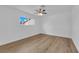 Bedroom featuring wood-look flooring, a ceiling fan, and a window at 3228 Robin Cir, Las Vegas, NV 89121