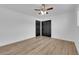Bedroom featuring wood-look flooring, a ceiling fan, and a closet at 3228 Robin Cir, Las Vegas, NV 89121