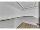Walk-in closet features ample shelving space and wood-style floors at 3228 Robin Cir, Las Vegas, NV 89121