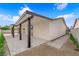 Exterior view of a house featuring a covered patio and landscaped backyard at 3228 Robin Cir, Las Vegas, NV 89121