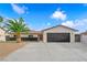 Inviting single-story home boasts a new driveway, a dark accent brick wall, and a beautiful mature palm tree at 3228 Robin Cir, Las Vegas, NV 89121