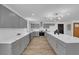 Updated kitchen with grey cabinets, marble countertops, and stainless steel appliances at 3228 Robin Cir, Las Vegas, NV 89121