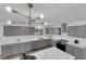 Beautiful kitchen with grey cabinets, marble counters, and stainless steel appliances at 3228 Robin Cir, Las Vegas, NV 89121