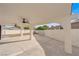 Covered patio area with ceiling fans, offering a comfortable outdoor space for relaxation and entertainment at 3228 Robin Cir, Las Vegas, NV 89121
