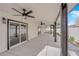 Covered patio featuring ceiling fans and direct access to the backyard at 3228 Robin Cir, Las Vegas, NV 89121