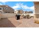 Private backyard featuring brick-paved area, fence and gravel, ideal for entertaining at 3405 Robust Robin Pl # 3, North Las Vegas, NV 89084