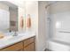 Clean bathroom with a white sink, vanity, a shower and tub combination, and essential toiletries at 3405 Robust Robin Pl # 3, North Las Vegas, NV 89084