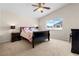 Comfortable bedroom featuring neutral carpet and a large window offering natural light at 3405 Robust Robin Pl # 3, North Las Vegas, NV 89084
