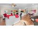 Open-concept living room with hardwood floors flows into kitchen and dining areas at 3405 Robust Robin Pl # 3, North Las Vegas, NV 89084