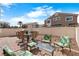 Cozy patio seating area with pavers and a well-maintained fence at 3405 Robust Robin Pl # 3, North Las Vegas, NV 89084