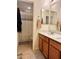Bathroom with double mirrors, tile flooring, wooden cabinets and shower at 346 Andy Wheeler Dr, Henderson, NV 89011