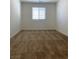 Bright bedroom with neutral carpeting and a window for natural light at 346 Andy Wheeler Dr, Henderson, NV 89011