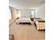 Comfortable main bedroom featuring a bed, side tables, and ample space, and soft carpet flooring at 346 Andy Wheeler Dr, Henderson, NV 89011