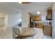 Kitchen with dining area and view to large living room at 3874 Cinnamonwood Way, Las Vegas, NV 89115