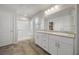 Modern bathroom with dual sinks, granite countertops, and glass shower at 4040 Beech Fern Ave, North Las Vegas, NV 89084