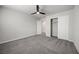 This carpeted bedroom has a modern ceiling fan and a double door closet at 4040 Beech Fern Ave, North Las Vegas, NV 89084