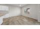 Living room featuring tile floors, granite countertops, and a window at 4040 Beech Fern Ave, North Las Vegas, NV 89084