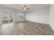 Living room with sliding glass door and view of backyard pool and mountains at 4040 Beech Fern Ave, North Las Vegas, NV 89084