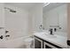 Bathroom features a shower-tub combination and dark colored vanity at 4224 Glisan Ct, Las Vegas, NV 89129