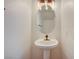 Clean bathroom featuring a pedestal sink and modern lighting at 4224 Glisan Ct, Las Vegas, NV 89129