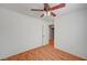 Clean bedroom design featuring a ceiling fan, wood-look floors, and natural light at 4224 Glisan Ct, Las Vegas, NV 89129