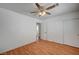 Bedroom with light wood-look floors, ceiling fan, and double closet at 4224 Glisan Ct, Las Vegas, NV 89129