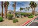 Community pool area showcases palm trees and well-maintained landscaping in a gated community at 4224 Glisan Ct, Las Vegas, NV 89129