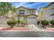 Inviting two-story home features well-maintained landscaping, an attached garage, and a cozy front entrance at 4224 Glisan Ct, Las Vegas, NV 89129
