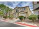 Attractive two-story home with low-maintenance landscaping, warm tones, and a convenient attached garage at 4224 Glisan Ct, Las Vegas, NV 89129
