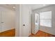 Hallway with white refrigerator and window providing natural light at 4224 Glisan Ct, Las Vegas, NV 89129