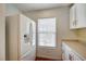 Kitchen area with white refrigerator and natural light coming from the window at 4224 Glisan Ct, Las Vegas, NV 89129