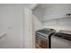 Laundry room with washer, dryer, and storage shelf at 4224 Glisan Ct, Las Vegas, NV 89129