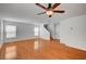 Inviting living room with wood floors, ceiling fan, and staircase access to upper level at 4224 Glisan Ct, Las Vegas, NV 89129