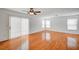 Bright living room featuring wood floors, natural light, and sliding glass doors to the outside at 4224 Glisan Ct, Las Vegas, NV 89129