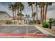 Designated parking area features mature palms and accessibility signage near a community entrance at 4224 Glisan Ct, Las Vegas, NV 89129