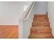Staircase with wood steps and landing leading to the upper floor at 4224 Glisan Ct, Las Vegas, NV 89129