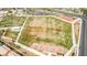 Overhead shot featuring community amenities including a park, tennis courts, and open green spaces at 4423 Creekside Cavern Ave, North Las Vegas, NV 89084