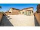 Expansive backyard with a neutral sandscape, perfect for customization and outdoor living at 4423 Creekside Cavern Ave, North Las Vegas, NV 89084
