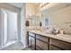 Bathroom featuring double sinks, modern fixtures, and an open doorway at 4423 Creekside Cavern Ave, North Las Vegas, NV 89084