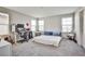 Bright bedroom with work area, large windows, and plush carpet at 4423 Creekside Cavern Ave, North Las Vegas, NV 89084