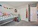 Bright ' bedroom with a loft bed, dinosaur decorations, and closet space at 4423 Creekside Cavern Ave, North Las Vegas, NV 89084