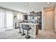 Stylish kitchen with granite countertops, stainless steel appliances, and bar stool seating at the island at 4423 Creekside Cavern Ave, North Las Vegas, NV 89084