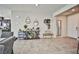 Inviting living area featuring neutral tones, tile flooring, and an open layout with stylish decor at 4423 Creekside Cavern Ave, North Las Vegas, NV 89084