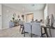 Bright and open living space with tile flooring, a dining table, and neutral paint colors at 4423 Creekside Cavern Ave, North Las Vegas, NV 89084
