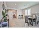 Spacious living and dining area with tile floors, shuttered windows, and modern furnishings at 4423 Creekside Cavern Ave, North Las Vegas, NV 89084
