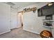 Upstairs loft area with shelves and a mounted TV, perfect for entertaining or relaxing at 4423 Creekside Cavern Ave, North Las Vegas, NV 89084