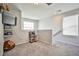 A spacious upstairs loft area with a large window, neutral walls and plush carpet at 4423 Creekside Cavern Ave, North Las Vegas, NV 89084