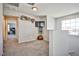 Bright loft space featuring neutral walls and carpet, with shelves and a mounted TV at 4423 Creekside Cavern Ave, North Las Vegas, NV 89084
