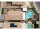 Stunning aerial view of a backyard featuring a private pool and spa, perfect for outdoor relaxation and entertainment at 4611 Julesburg Dr, Las Vegas, NV 89139