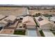 An aerial view of a residential area with houses featuring desert landscaping and tiled roofs at 4611 Julesburg Dr, Las Vegas, NV 89139